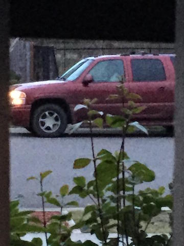 This red SUV was on Kimberly Rew's street for a few days at the end of February. The man inside claimed to be with an alarm company but couldn't prove it. Photo from Kimberly Rew.